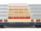 two trains that are sitting side by side on a white surface