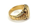 an image of a close up of a gold ring on a white surface