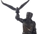 a statue of a man holding a bird in his hand