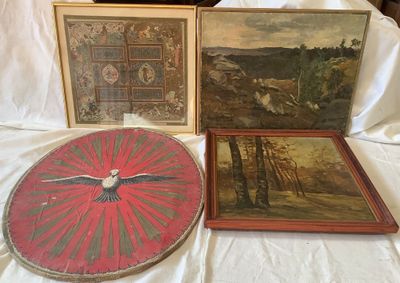 three framed paintings and a clock on a bed with a white sheet