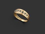 a gold ring with emeralds and diamonds on a black background