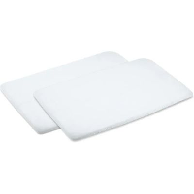 a pair of white bath mats sitting on top of each other