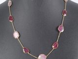 a close up of a necklace on a mannequin mannequin