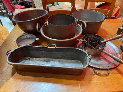a table with a lot of pots and pans on it
