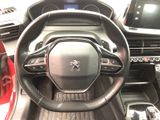 the interior of a car with a steering wheel and dashboard controls