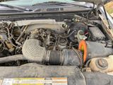 a picture of a car engine with its hood open