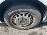 a tire that has been scratched off of the car