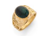 gros plan d'une bague en or avec une pierre verte