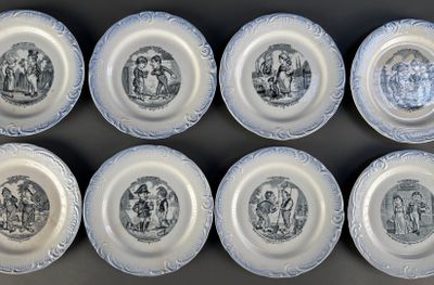 six blue and white plates with black and white designs on them