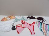 a lot of underwear and a pair of shoes on a table