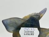 a picture of a glass bird with a tag on it ' s neck