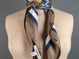 a close up of a mannequin torso with a scarf on it