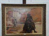 un tableau représentant un homme à cheval dans le désert