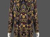 a black and gold dress with a floral pattern on it
