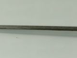 a small sword that is laying on a white surface