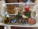a white basket filled with assorted items on a table