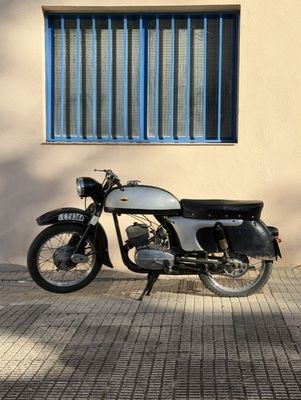 a motorcycle that is parked in front of a building