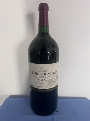 a bottle of wine that is sitting on a table