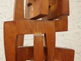 a wooden sculpture that is sitting on a table