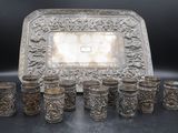 an image of a silver tray with six cups and a tray with a silver tray on it