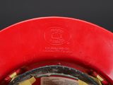 a red fire hydrant with a yellow hose attached to it