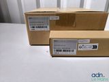 two boxes are stacked on top of each other on a table