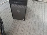 a desktop computer sitting on the floor next to a trash can