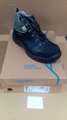 a box with a pair of black shoes on it