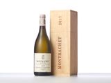a bottle of wine next to a wooden box