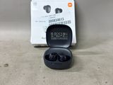 a box of ear buds sitting on the floor