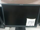 a computer monitor sitting on a desk with a price tag on it