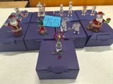 a lot of glass figurines that are on the table