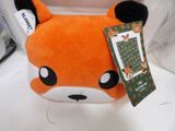 a stuffed animal with a tag on it ' s head