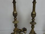 two candles that are sitting next to each other
