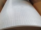 a close up of a roll of black and white paper on top of a table