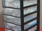 an image of a stack of plastic drawers on a table