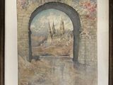 aquarelle encadrée représentant la vue d'un château à travers une arcade