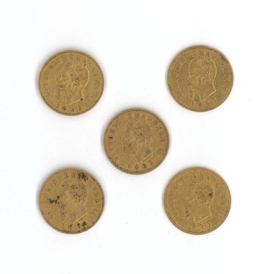 four different types of gold coins on a white surface
