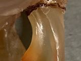 a close up of a piece of glass with a toothbrush in it