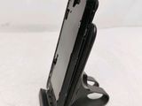 a cell phone that is sitting on a stand