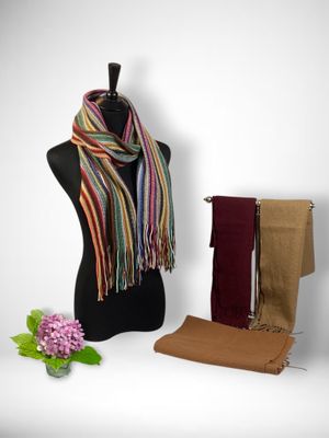 a mannequin with a scarf, scarf, and other items on it