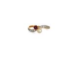 a close up of a ring with a pearl and a diamond