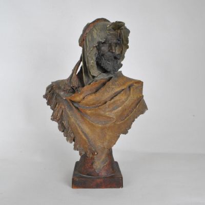 statue of a woman with a veil on her head on a pedestal