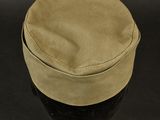 a close up of a hat on a black hat stand