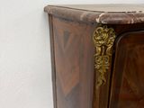 a wooden cabinet with a door and a drawer on top of it