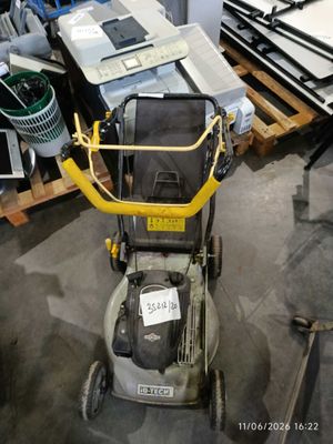 a lawn mower that is sitting on the floor