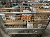 a metal cart with many boxes of food inside of it
