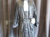 a mannequin dressed in a black robe and hat