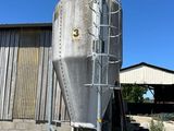 a large metal tank that is outside of a building