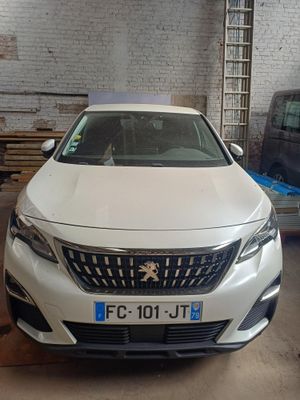 a white car that is parked in a garage